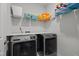 Convenient laundry room with modern washer and dryer, plus organized shelving for easy storage at 98 Stone Bridge Xing # 98, Chapel Hill, NC 27517