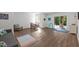 Spacious living room with wood flooring, comfortable seating, and a sliding door to the outside at 98 Stone Bridge Xing # 98, Chapel Hill, NC 27517
