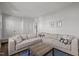 Comfortable living room with a large sectional sofa and natural light at 98 Stone Bridge Xing # 98, Chapel Hill, NC 27517
