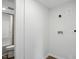 Bathroom featuring a toilet, shower and washing machine hook ups at 1006 E Harnett St, Dunn, NC 28334