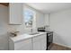 Clean kitchen design with marble countertops, bright white cabinets, and new appliances at 1006 E Harnett St, Dunn, NC 28334