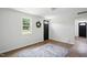 Well-lit living room with hardwood floors and a wreath, featuring fresh paint and modern design at 1006 E Harnett St, Dunn, NC 28334