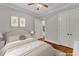Comfortable bedroom featuring hardwood floors and soft, neutral decor at 104 Bellagio Dr, Apex, NC 27539