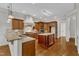 Beautiful kitchen with granite counters, stainless steel appliances, and hardwood flooring at 104 Bellagio Dr, Apex, NC 27539