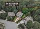 Aerial view of home at 104 Bellagio Dr, Apex, NC 27539, featuring lush backyard and circular driveway at 104 Bellagio Dr, Apex, NC 27539