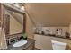 Bathroom with granite counters, framed mirror, and decorative fixtures at 104 Bellagio Dr, Apex, NC 27539