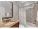 Bathroom featuring a granite countertop vanity and a shower-tub combination at 104 Bellagio Dr, Apex, NC 27539