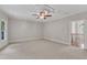 Bright bedroom featuring recessed lighting, neutral walls and carpeting with an open doorway at 104 Bellagio Dr, Apex, NC 27539