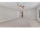Bright bedroom with neutral walls and carpeting featuring a ceiling fan and recessed lighting at 104 Bellagio Dr, Apex, NC 27539