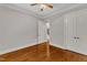 Cozy bedroom with neutral paint, hardwood floors, crown molding, and double doors at 104 Bellagio Dr, Apex, NC 27539
