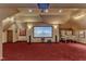 Spacious entertainment room featuring large screen and game consoles at 104 Bellagio Dr, Apex, NC 27539