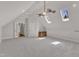 Large bonus room with carpet, skylights, and a ceiling fan at 104 Bellagio Dr, Apex, NC 27539