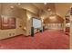 Large entertainment room with a projection screen and built-in cabinetry at 104 Bellagio Dr, Apex, NC 27539