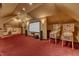 Bonus room featuring a projection screen with speakers and vintage arcade games at 104 Bellagio Dr, Apex, NC 27539