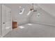 Large bonus room with carpet, skylights, and a ceiling fan at 104 Bellagio Dr, Apex, NC 27539