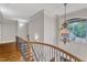 Elegant foyer area featuring a chandelier, a staircase, and a view of the outside at 104 Bellagio Dr, Apex, NC 27539