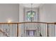 Elegant foyer area featuring a chandelier, a staircase, and a view of the outside at 104 Bellagio Dr, Apex, NC 27539
