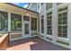 This beautiful screened porch features recessed lighting, wood floors and an outdoor view at 104 Bellagio Dr, Apex, NC 27539