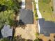 Aerial view of a home showcasing its roof, landscaping, and proximity to neighboring properties at 107 Mohave Dr, Louisburg, NC 27549