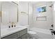Bathroom featuring vanity with a sink, white cabinets and marble tiled shower at 107 Mohave Dr, Louisburg, NC 27549