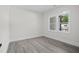 This bedroom has bright windows and neutral walls, perfect for a relaxing and comfortable retreat at 107 Mohave Dr, Louisburg, NC 27549