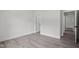 Bedroom featuring gray wood floors, white walls and trim at 107 Mohave Dr, Louisburg, NC 27549