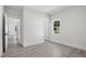 Bedroom with gray wood floors and white trim at 107 Mohave Dr, Louisburg, NC 27549