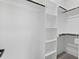 Walk-in closet with shelving and gray wood floors at 107 Mohave Dr, Louisburg, NC 27549