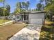 A beautifully designed two-story home with a two-car garage and a well-manicured front yard at 107 Mohave Dr, Louisburg, NC 27549