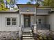 Inviting front entrance showcasing stone accents, stylish railings, and a covered porch at 107 Mohave Dr, Louisburg, NC 27549