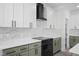 Close up of kitchen with marble counters, a stylish range hood, and modern appliances at 107 Mohave Dr, Louisburg, NC 27549