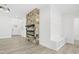 Open concept living room with stone fireplace and custom bench and storage area at 107 Mohave Dr, Louisburg, NC 27549
