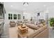 Bright living room featuring modern furniture, large windows, and an open concept layout at 107 Mohave Dr, Louisburg, NC 27549