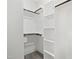 This walk-in closet has custom shelving and hanging rods providing ample storage for clothing and accessories at 107 Mohave Dr, Louisburg, NC 27549