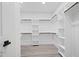 Walk-in closet with shelving and wood floors at 107 Mohave Dr, Louisburg, NC 27549