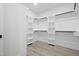Walk-in closet with shelving and gray wood floors at 107 Mohave Dr, Louisburg, NC 27549