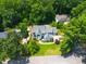 Stunning aerial view of home with manicured lawn, mature trees, and an inviting driveway at 109 Greenock Ct, Cary, NC 27511