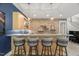 A bar area featuring barstools and brick accent wall at 109 Greenock Ct, Cary, NC 27511
