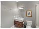 Modern bathroom showcasing a sleek floating vanity, gray walls, and toilet at 109 Greenock Ct, Cary, NC 27511