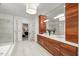 An elegant bathroom features a soaking tub, walk-in shower, and wooden double sink vanity at 109 Greenock Ct, Cary, NC 27511