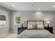 This bright, well-lit bedroom features large windows, neutral walls, and hardwood floors at 109 Greenock Ct, Cary, NC 27511