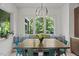 Bright breakfast nook with bench seating and a view of the lush outdoors at 109 Greenock Ct, Cary, NC 27511