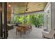 Covered porch with plenty of seating and an outdoor dining area at 109 Greenock Ct, Cary, NC 27511