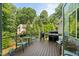 Spacious wooden deck with outdoor seating and cooking area at 109 Greenock Ct, Cary, NC 27511