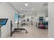 Bright home gym features mirrored wall, ballet bar and mounted TV for at-home workout convenience at 109 Greenock Ct, Cary, NC 27511