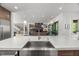 Gourmet kitchen featuring stainless steel appliances, white marble countertops, and open floor plan at 109 Greenock Ct, Cary, NC 27511