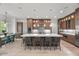 Beautiful kitchen with stainless steel appliances, island with seating, and open to the dining area at 109 Greenock Ct, Cary, NC 27511