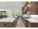Kitchen features a large island, modern appliances, and a seamless flow into the living and dining areas at 109 Greenock Ct, Cary, NC 27511