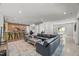 An expansive living room featuring a plush sofa, stylish rug, and a bar area for entertaining at 109 Greenock Ct, Cary, NC 27511