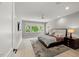 Spacious primary bedroom with large windows, ceiling fan, and plush bedding at 109 Greenock Ct, Cary, NC 27511
